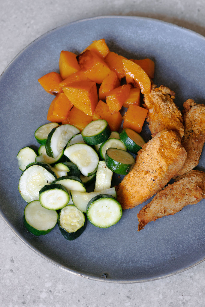 Crumbed Chicken Breast Tenders with Roasted Zucchini and Butternut