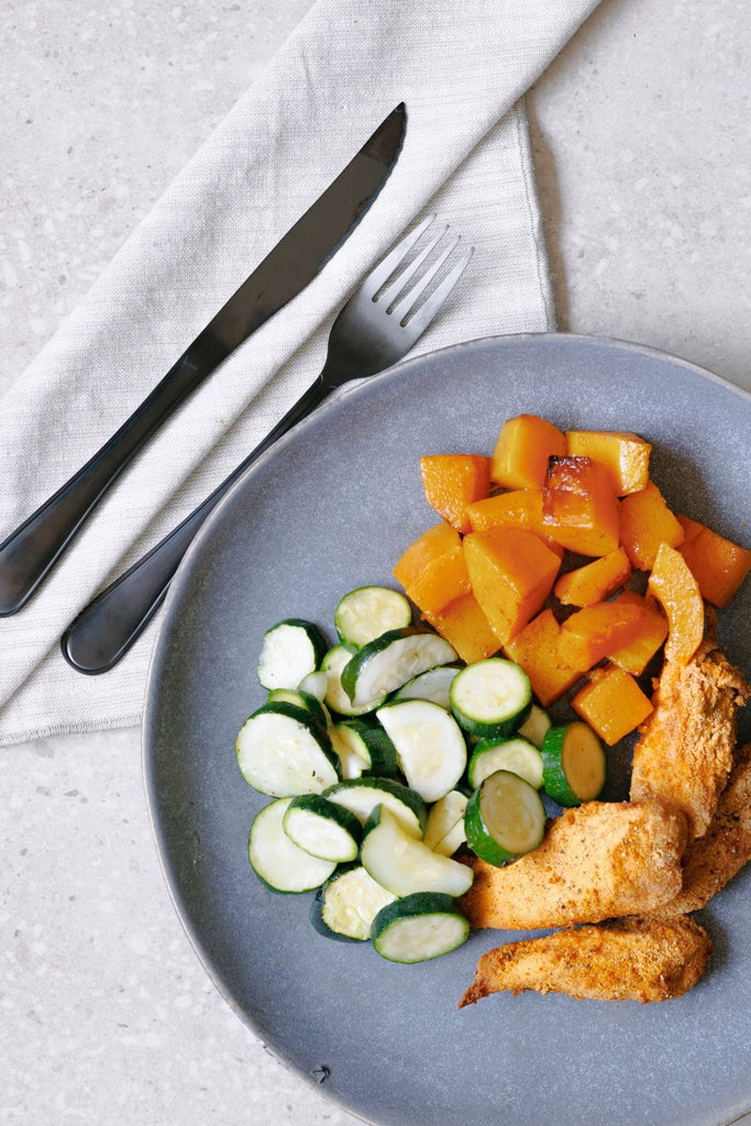 Crumbed Chicken Breast Tenders with Roasted Zucchini and Butternut - Plated Convenience