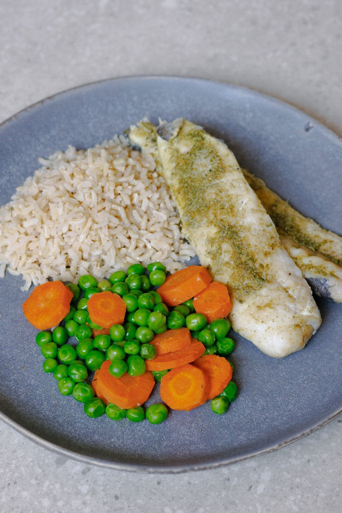 Steamed Hake Fillet with Brown Rice, Carrots and Peas - Plated Convenience